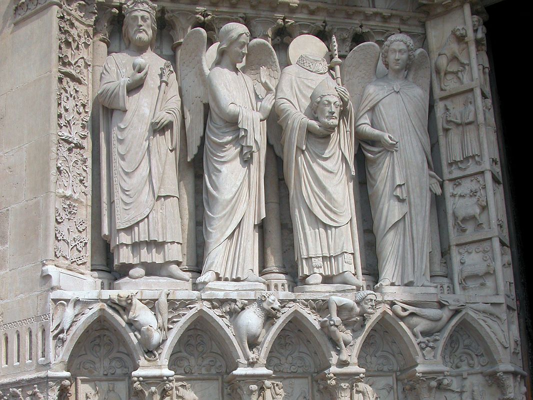 Paris 07 Notre Dame Left Side Saint Denis Holding his Head in his Hands Flanked By Angels 